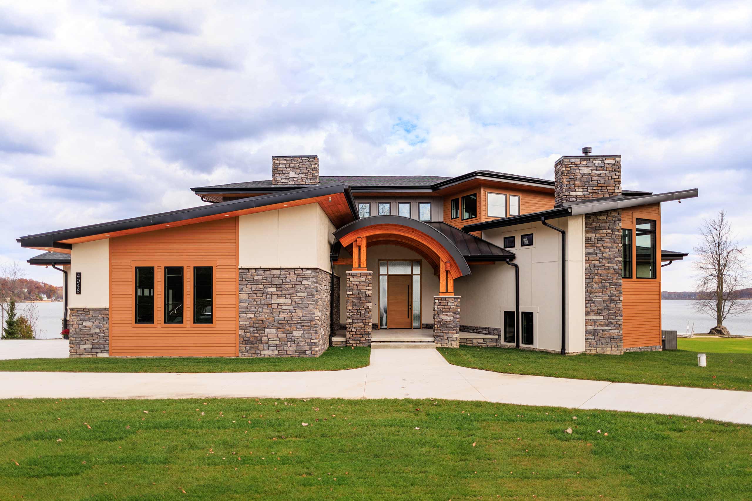 Woodline Building Company Modern Lakefront Lake Nepessing Lapeer, Michigan Front Elevation Curved Roof