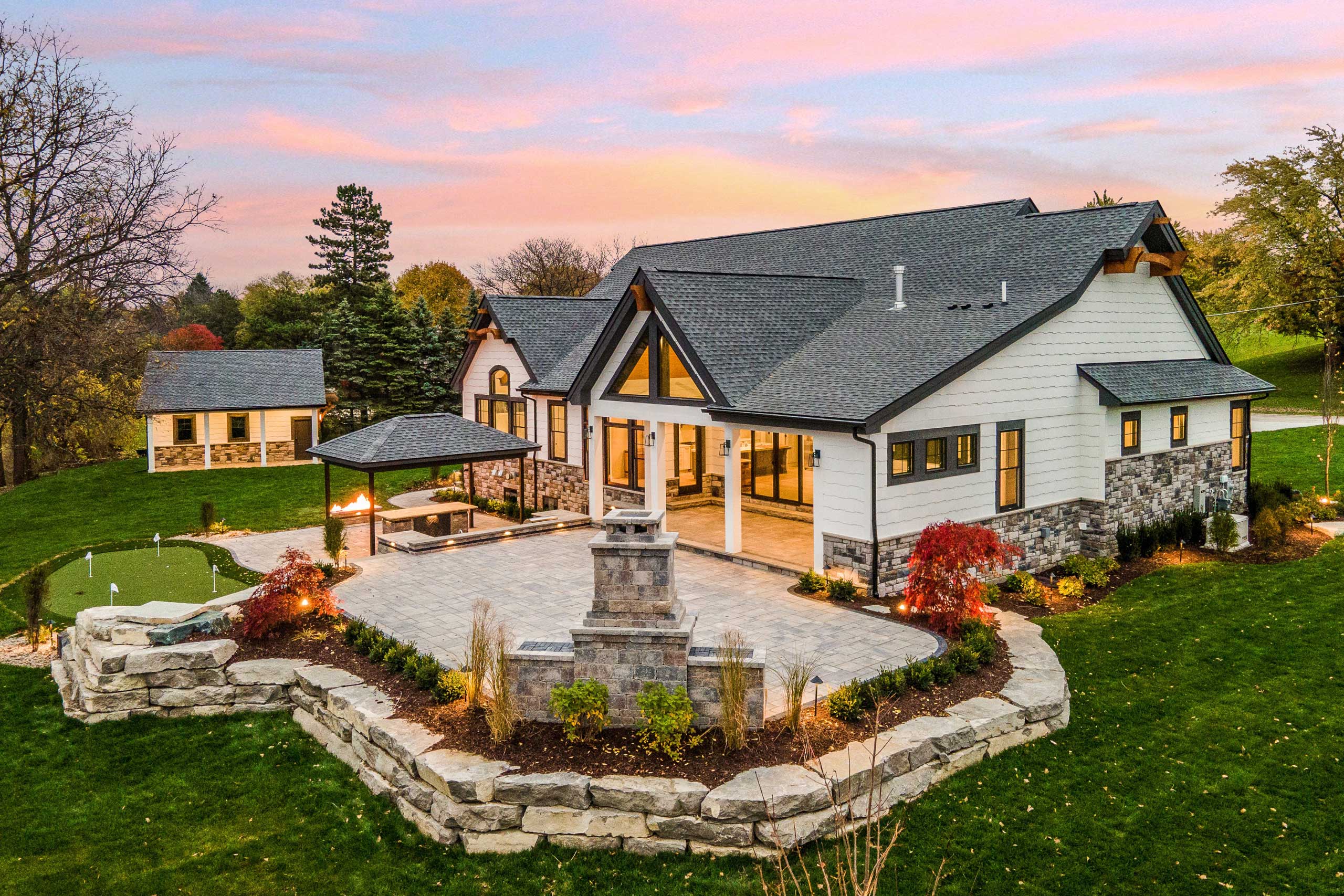 Woodline Building Company Golfers Haven Side Elevation Fireplace Close Up Twilight