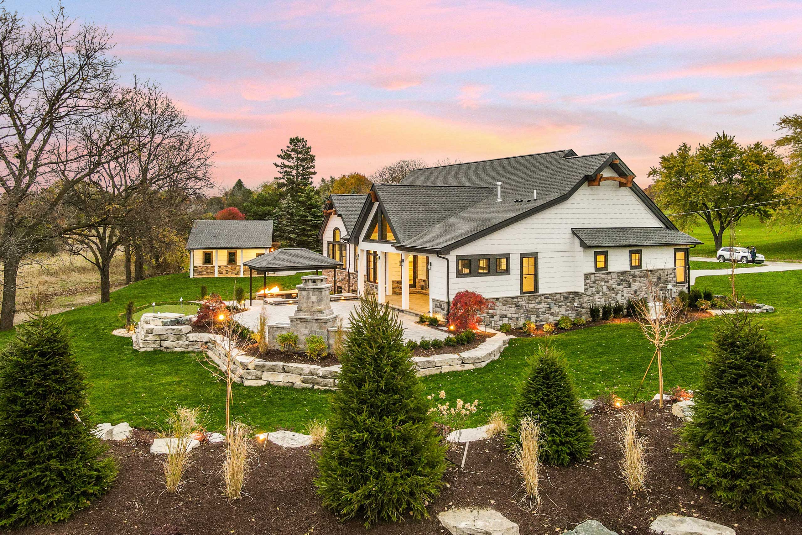 Woodline Building Company Golfers Haven Side Elevation Fireplace Drone Twilight